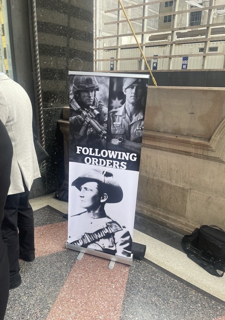 A sign outside court put up by RAAF veteran Trevor Stewart