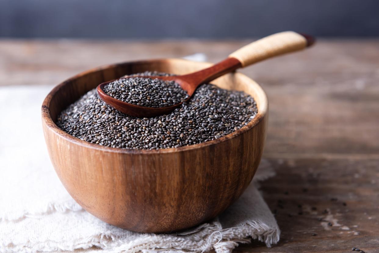 Bowl and spoon with chia seeds closeup