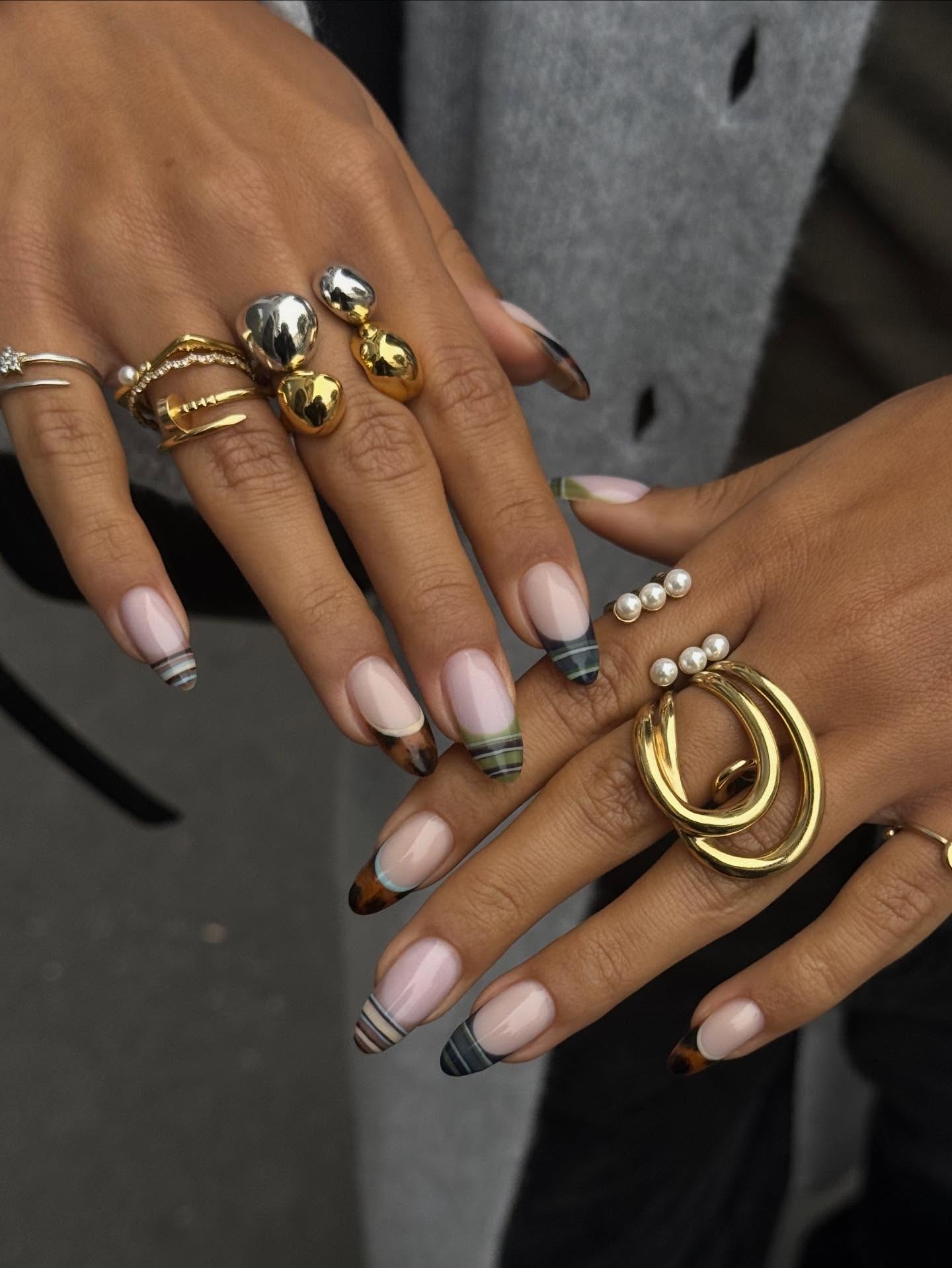 A set of mismatched striped nails.