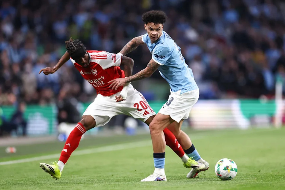  Nico O'Reilly battles for possession with Arsenal's Noni Madueke. 