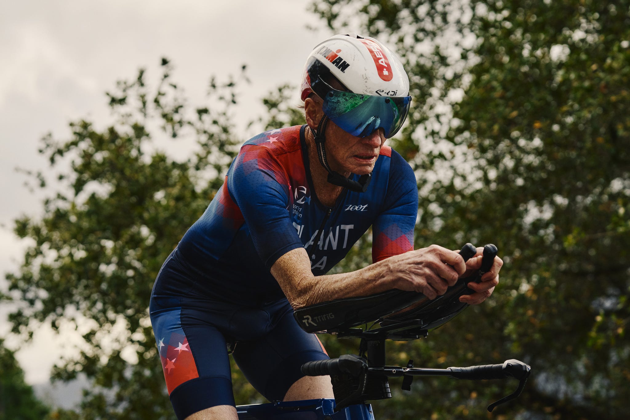 Athlete in a time trial position on a racing bicycle.