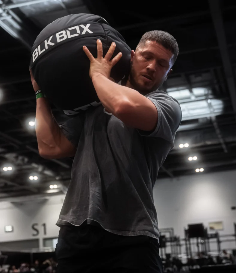 man hold a Blk Box medicine ball