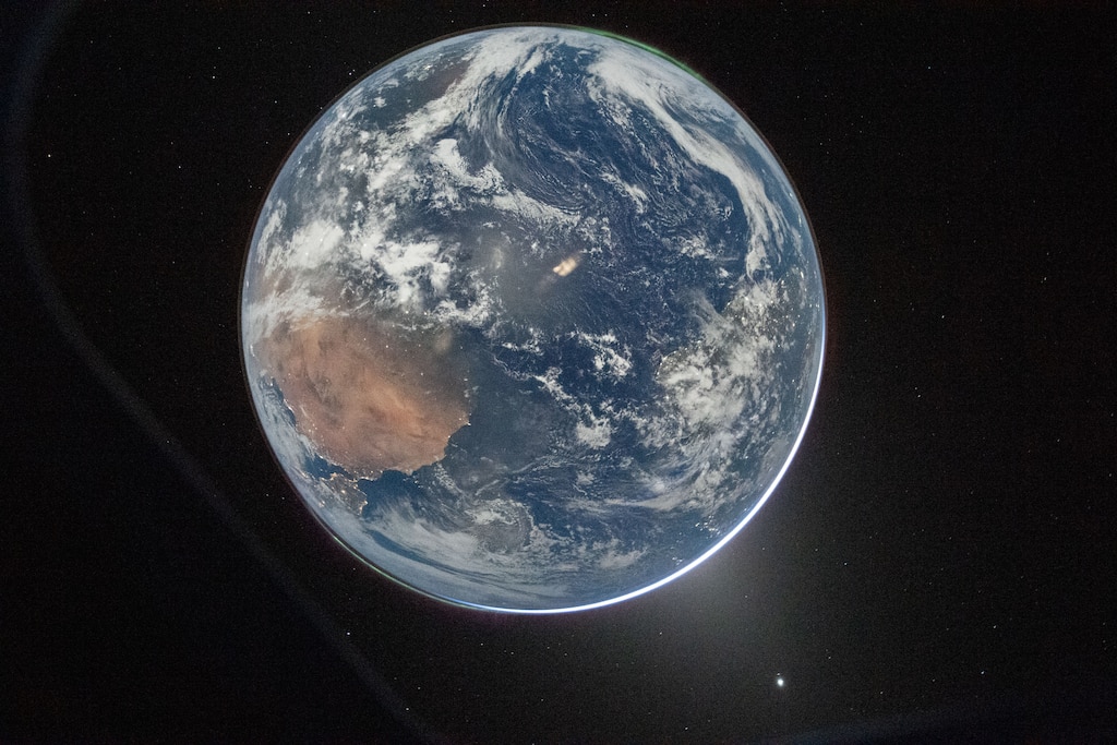 NASA astronaut and Artemis II Commander Reid Wiseman took this picture of Earth from the Orion spacecraft's window on April 2, 2026, after completing the translunar injection burn.