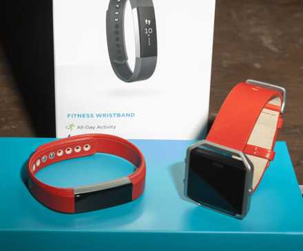 Fitbit devices on a Fitbit product box