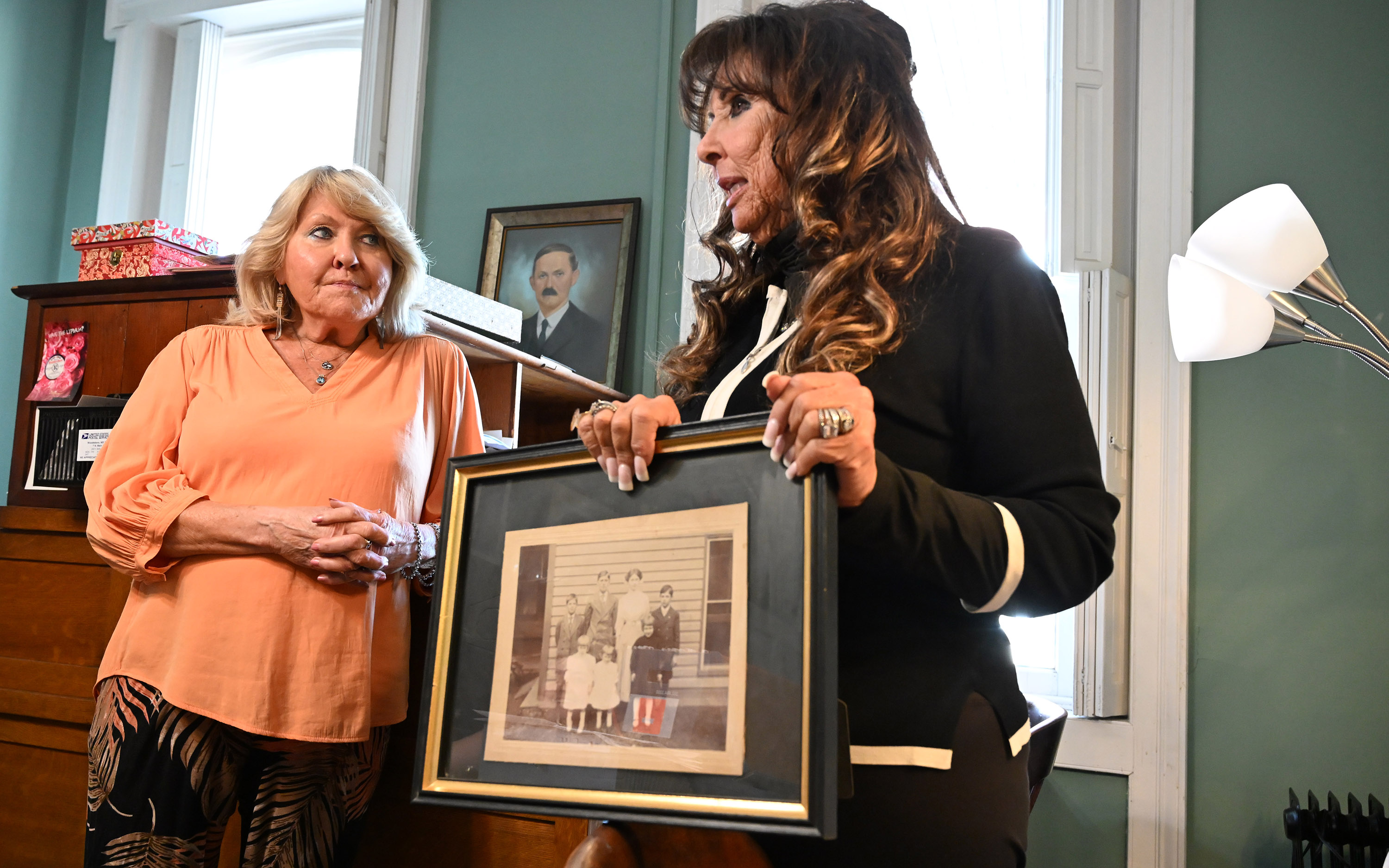 Cousins Linda Pruitt-Michielli, left, and Mary Jo Zentz, holding a...