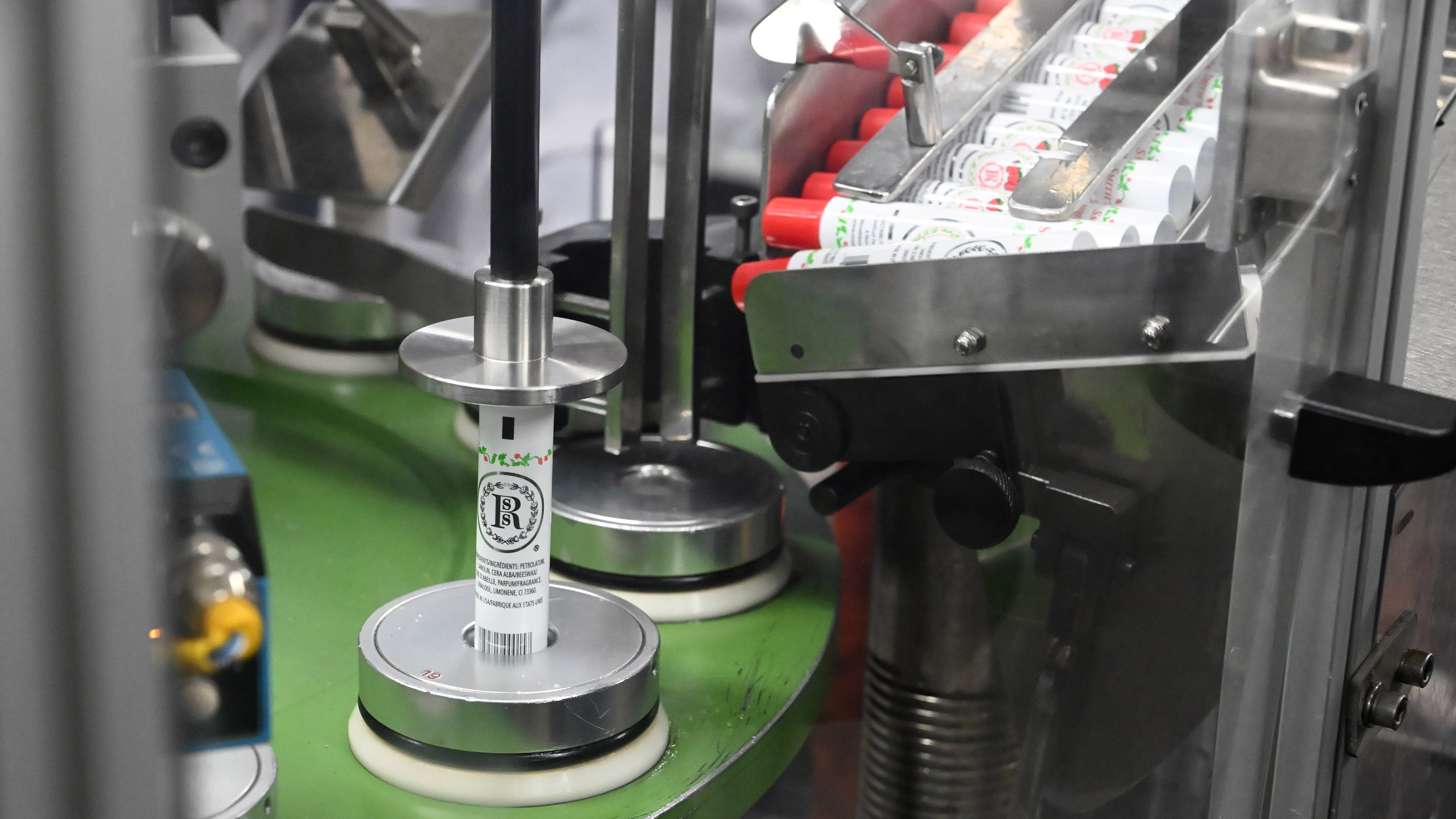 Tubes of Smith's Strawberry Lip Balm are filled at Case...