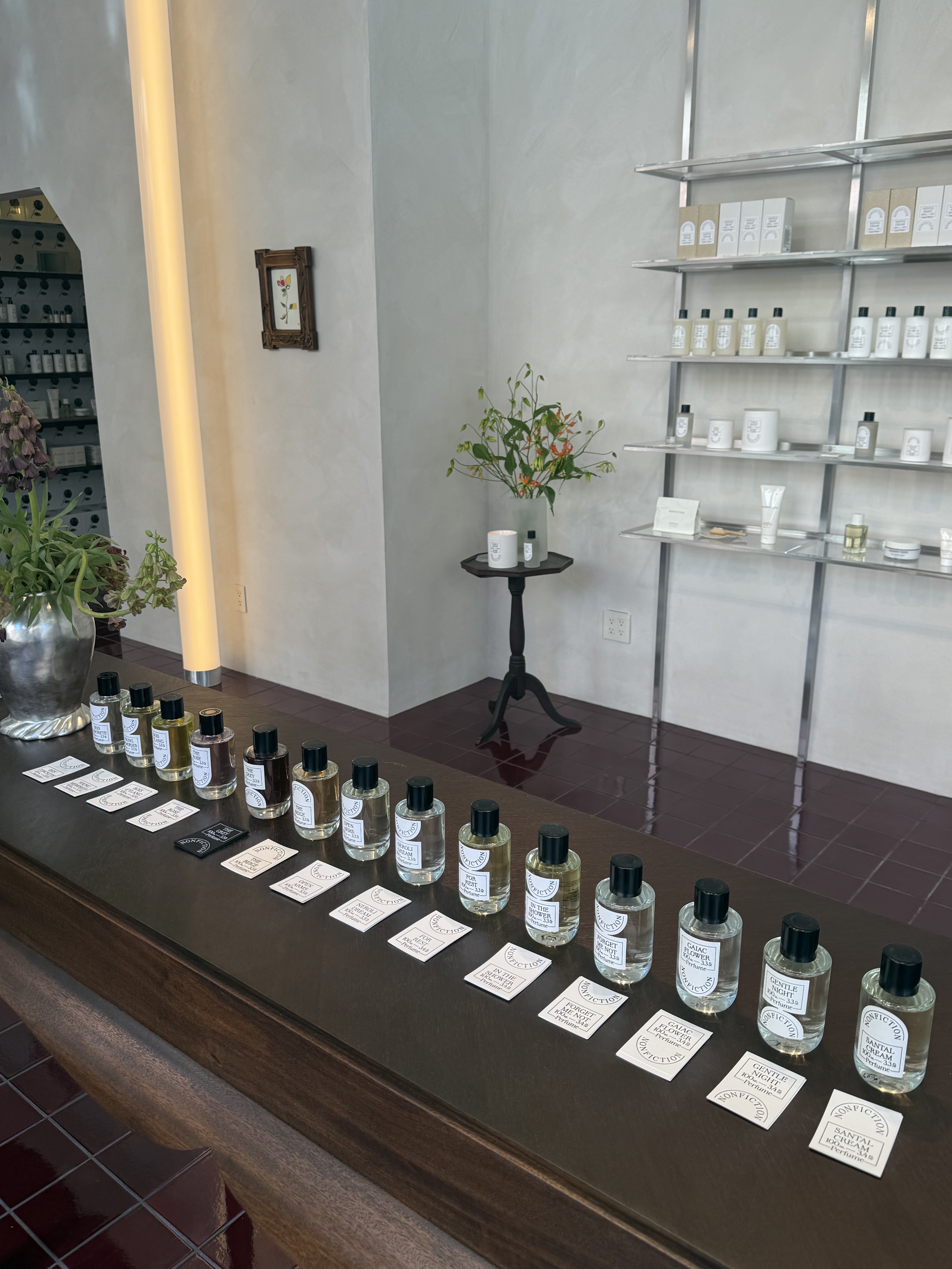 inside nonfiction store in lower east side new york city, with white walls and a wooden table