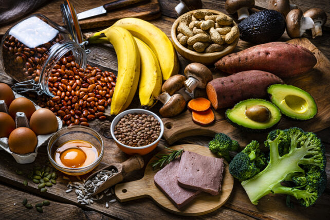 Foods including meat, eggs, bananas, broccoli, sunflower seeds, beans, lentils, avocado, mushrooms, peanuts and sweet potato