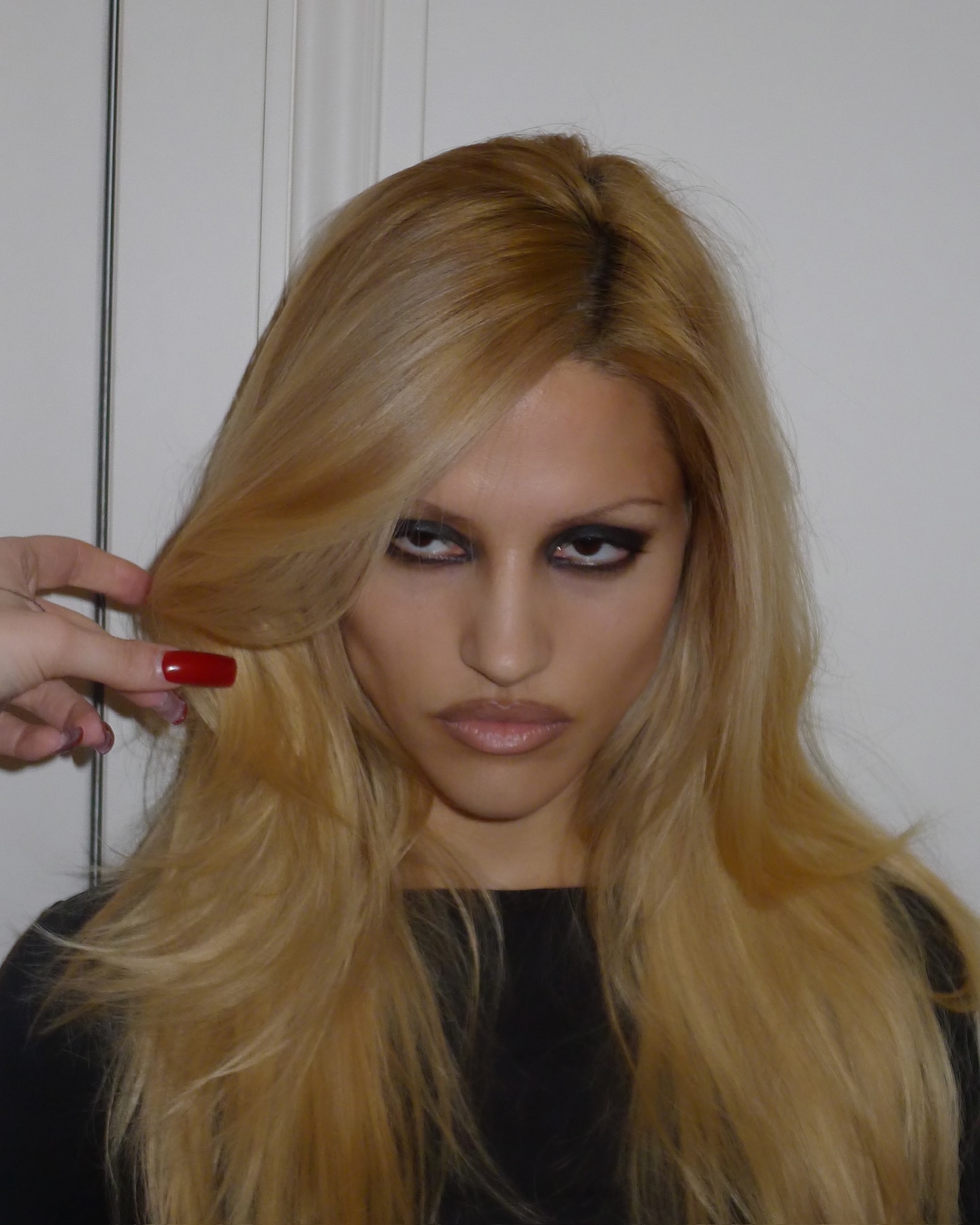 An image of Gabbriette with messy smoky eyes.