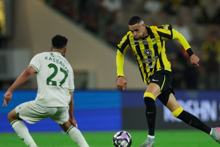 Video: After a six-month absence, Al-Nusairi begins his run-out with Al-Ittihad Having been sidelined since early last season, striker Abderrazak Hamdallah, known as Al-Nusairi, has finally returned to competitive action for Al-Ittihad. The club’s medical staff confirmed that he completed the full pre-match warm-up without discomfort and was subsequently included in the starting XI. Head coach Carlos Carvalhal expressed satisfaction with the forward’s progress, emphasising that the extended lay-off was necessary to fully recover from a persistent groin injury. “We did not want to rush him back too soon,” Carvalhal explained. “The most important thing was to protect his long-term fitness, and now he is ready to contribute.” Al-Nusairi’s return comes at a crucial time for Al-Ittihad, who are chasing a top-three finish in the Saudi Professional League. With 10 matches remaining, the club needs goals, and the Moroccan international’s proven ability to find the net could prove decisive. In his first appearance since September, Al-Nusairi showed flashes of the form that made him one of the league’s most feared attackers. He linked up well with fellow forward Romarinho, exchanged clever one-touch passes, and looked sharp in front of goal. Although he did not score on this occasion, his movement and understanding with the midfielders suggested that goals are not far away. Supporters, who had been calling for his return, welcomed him back with chants and banners. The positive atmosphere inside the stadium appeared to lift the entire team, and Al-Ittihad dominated possession for long periods. The coaching staff will now manage his game time carefully to ensure he regains full match fitness without risking another setback. With Al-Nusairi back in the lineup, Al-Ittihad’s attacking options have received a significant boost. His partnership with Romarinho promises to be a key factor in the club’s push for European qualification, and fans will be hoping that the goals start flowing once again