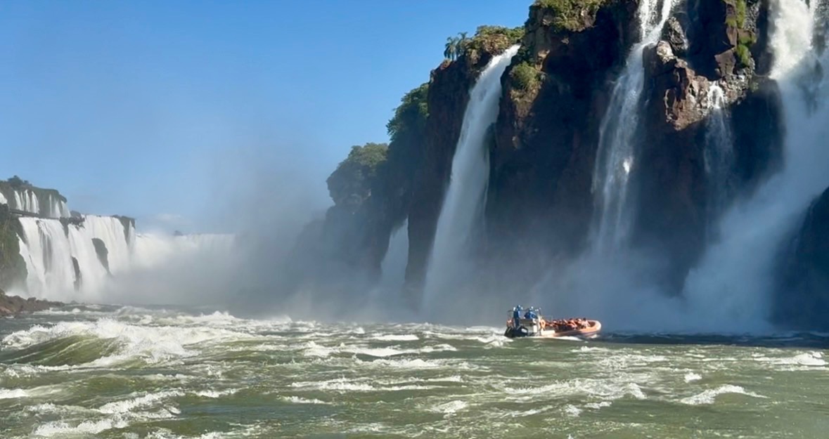 Tourist sightseeing boats go right up to the falls at...