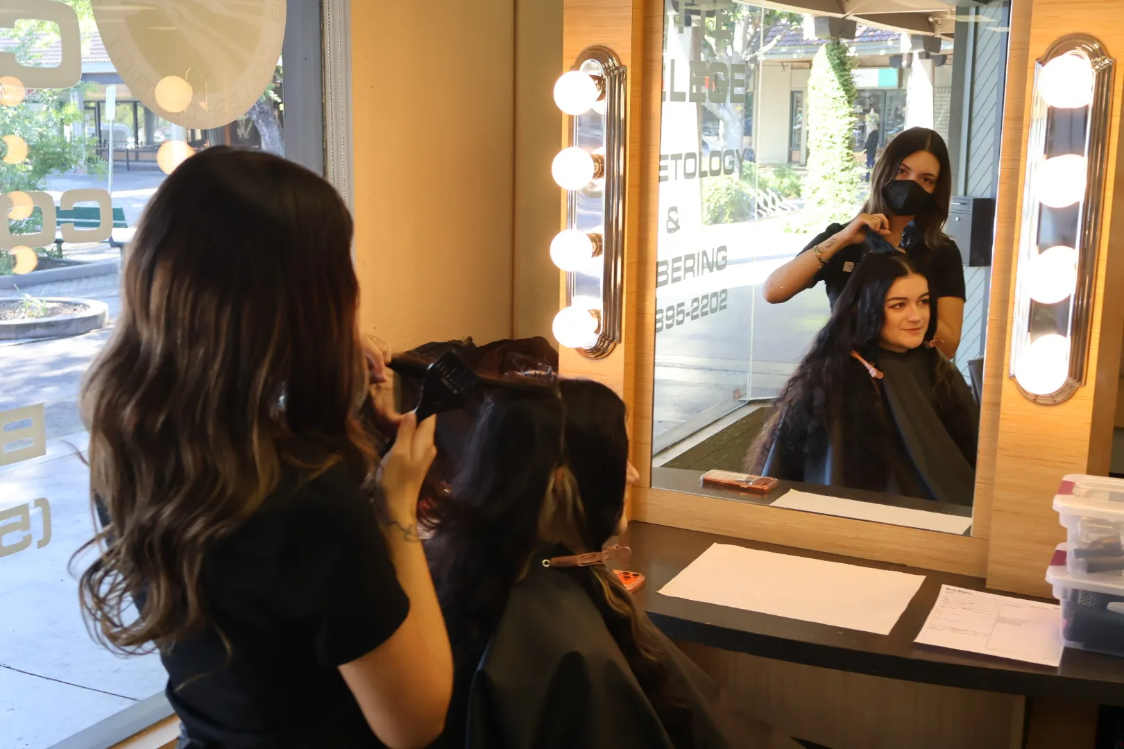 Isabelle Magdalena does Molly Myers's hair at the Butte College...