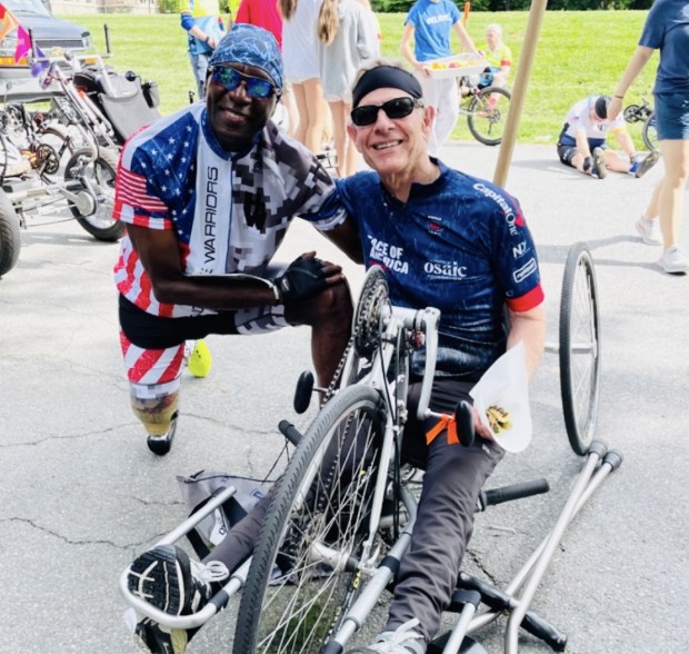 Larry Way, sitting on the hand-powered bike, looks forward to seeing his cycling buddies through PCAS at the start of their new cycling season next month. (Photos submitted by PCAS and Larry Way)