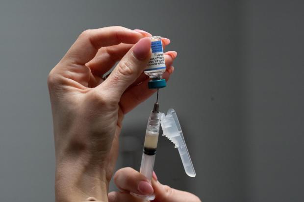 Lauren Ellenburg, a nurse, prepares a combination measles, mumps and rubella vaccine for a 12-month-old at Tiger Pediatrics in Easley, S.C., on March 17, 2026. (AP Photo/Mary Conlon)