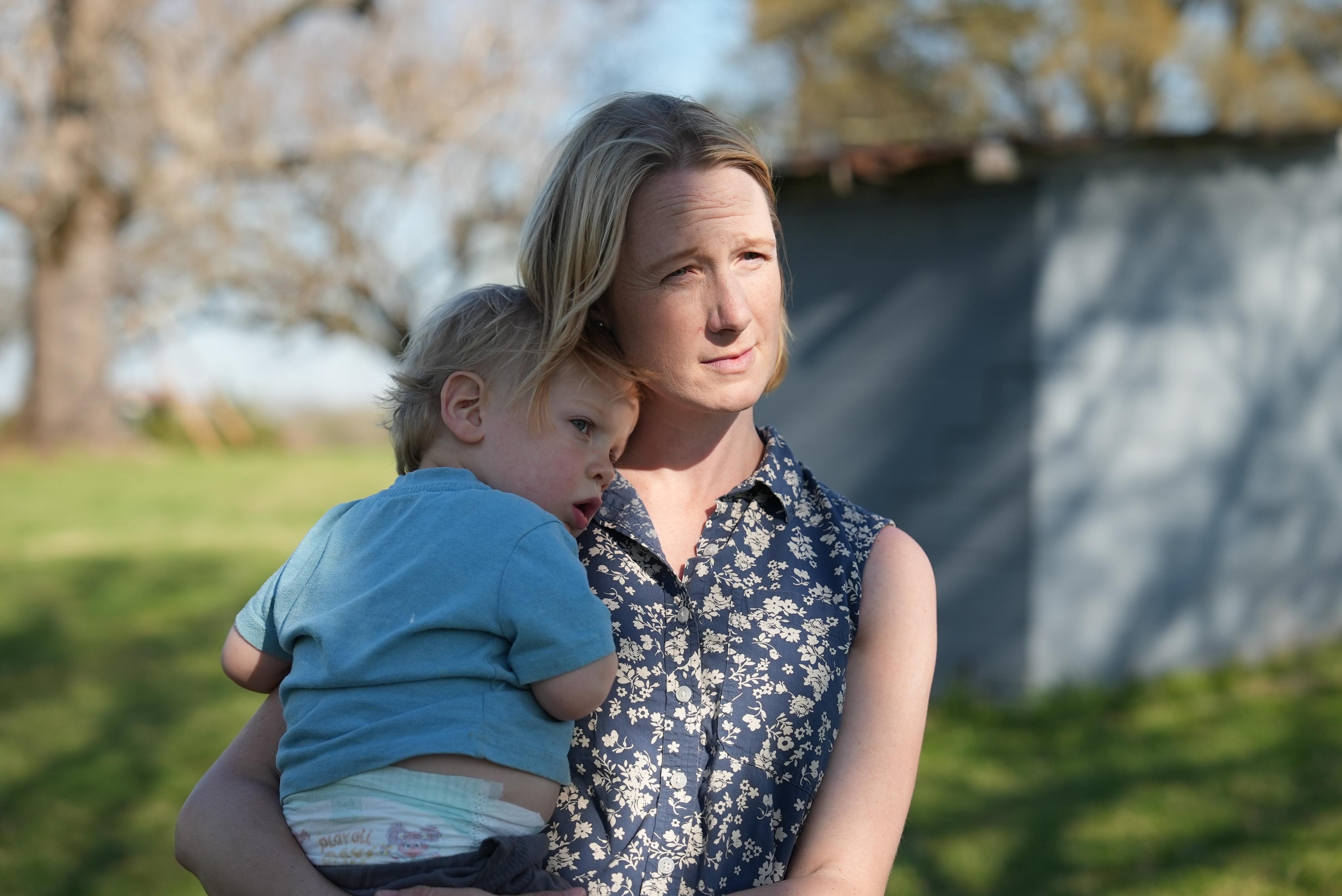Helen Kaiser holds her son at their home in Landrum,...