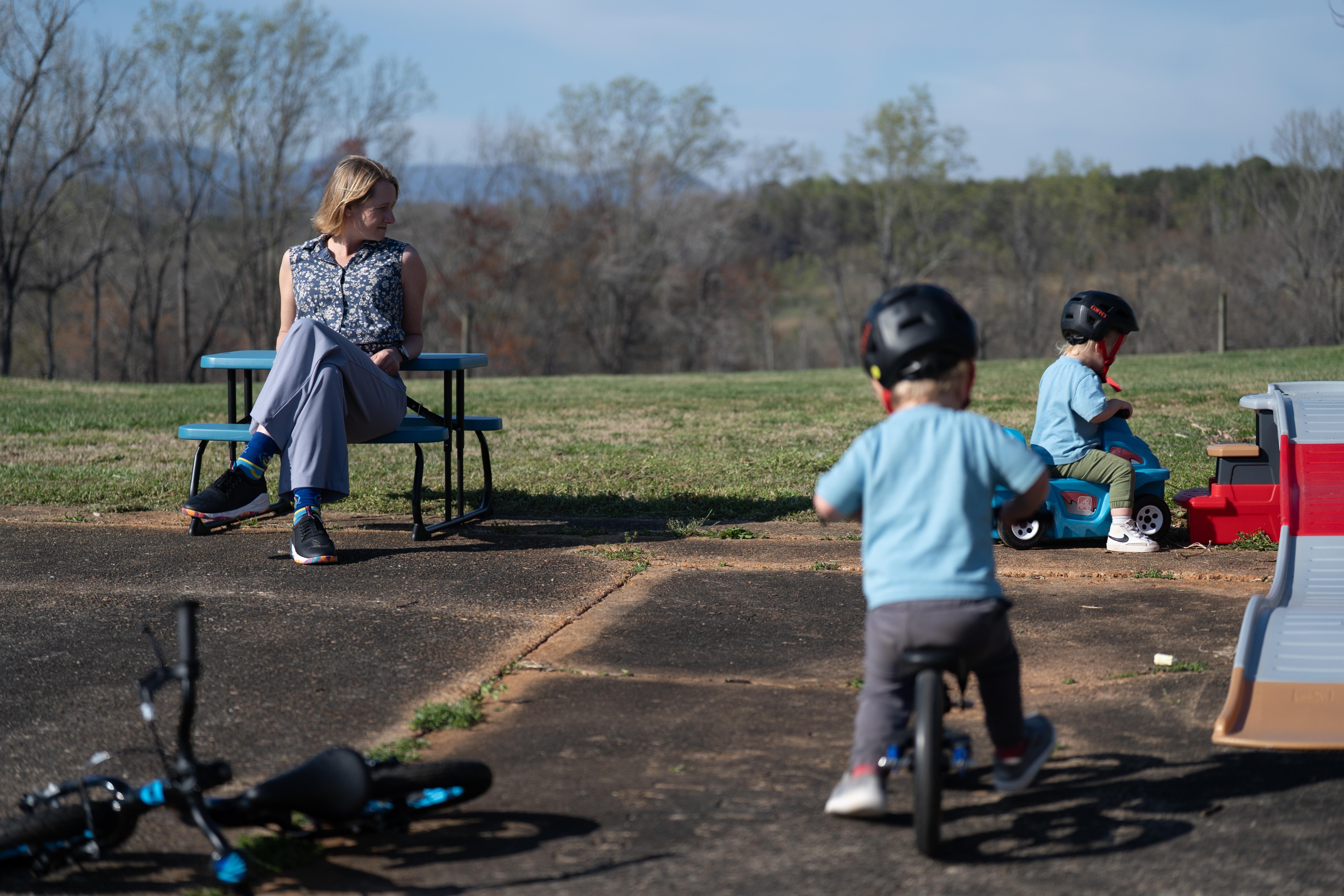 Helen Kaiser watches her sons play at their home in...