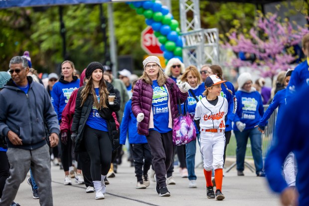 Participants in a previous Walk for Wellness House. This year's event will be May 3 at Home of Hope in Hinsdale. The Wellness House provides free programs for cancer patients and their families. (Marcello Rodarte)