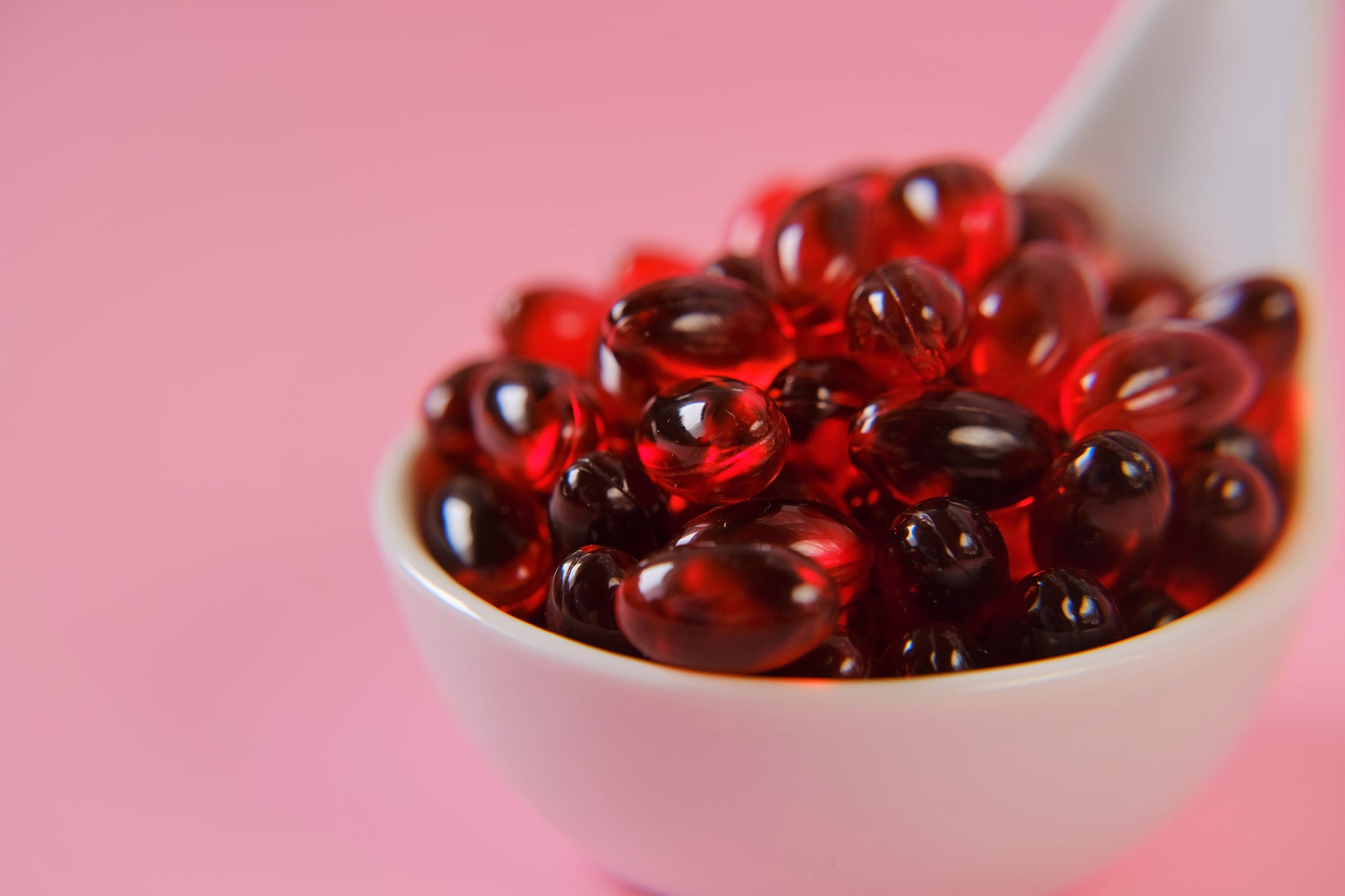 Krill oil. Red gelatin capsules with krill oil. omega-3 fatty acids. Natural supplements