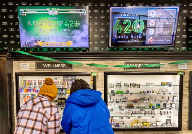 Shoppers for 420 deals waited a long line in the rain to enter the Mercy Wellness Dispensary on the unofficial holiday for cannabis users Monday, April 20, 2026 in Santa Rosa. (John Burgess/The Press Democrat)