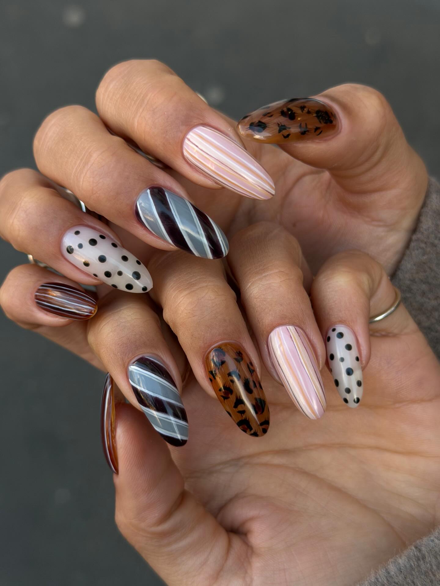An image of tie-inspired striped nails.