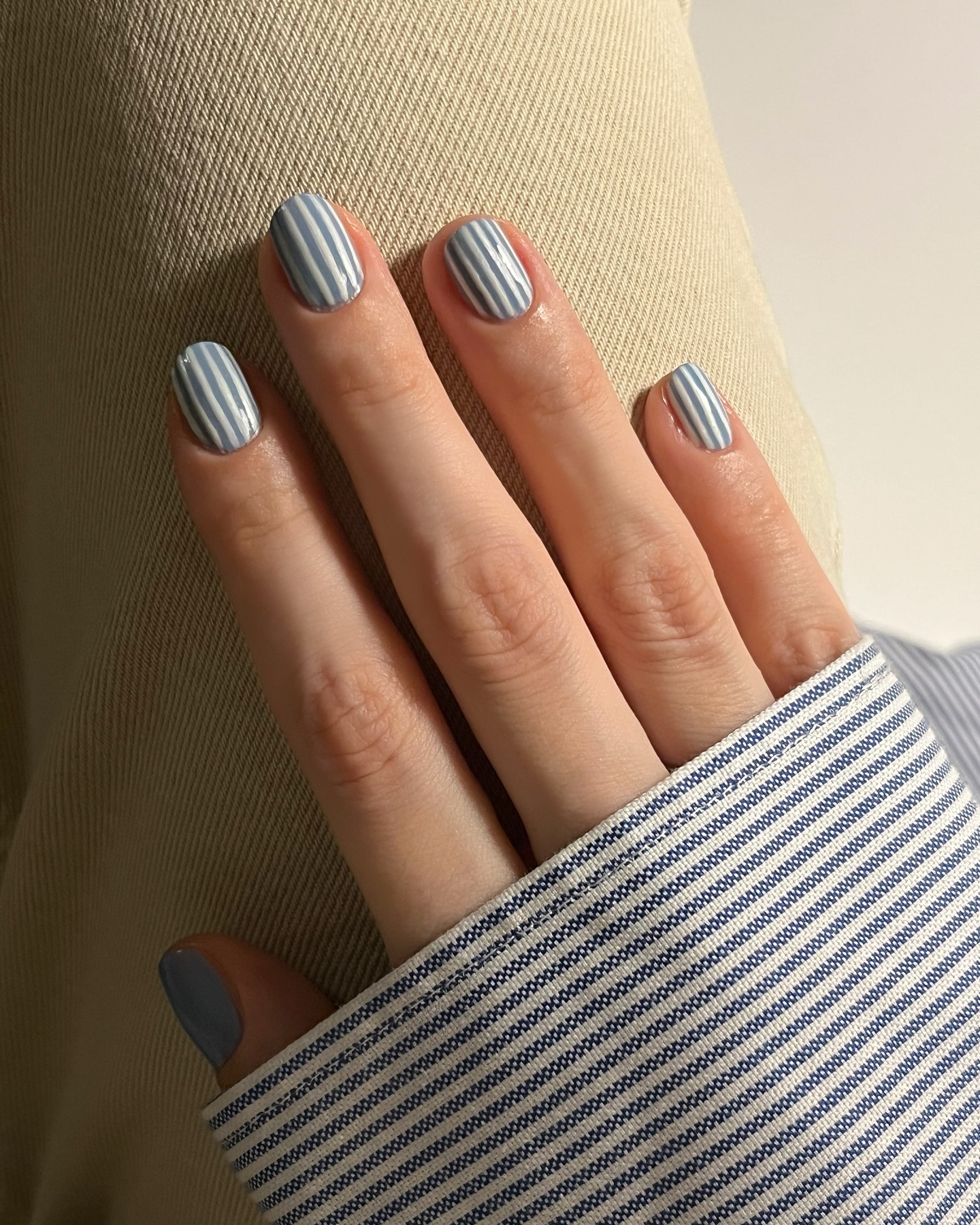 Pinstriped nails.