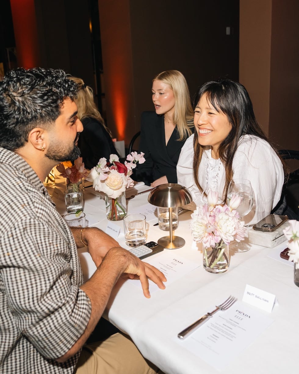 group of people dining at a stylish table setup