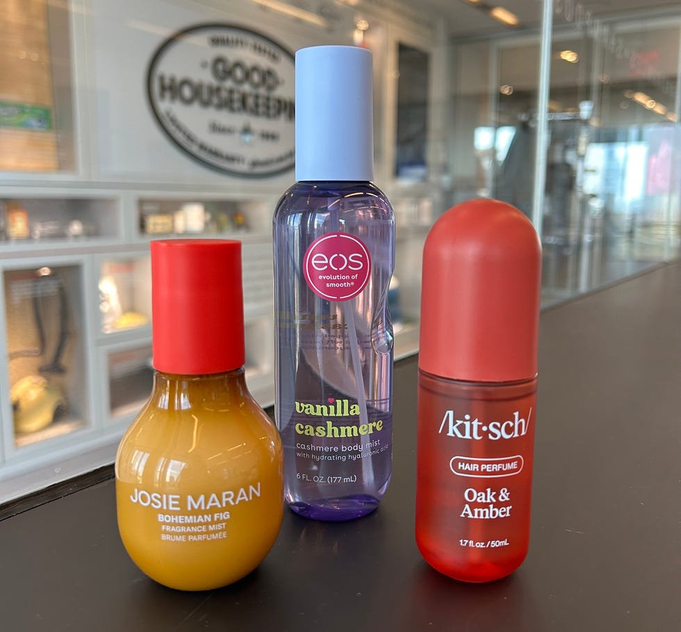 Three fragrance products displayed on a counter.