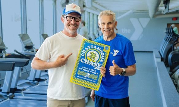 Alan Outlaw (left) and Baron Herdelin-Doherty showcase the 2026 Chattanooga Chase commemorative poster