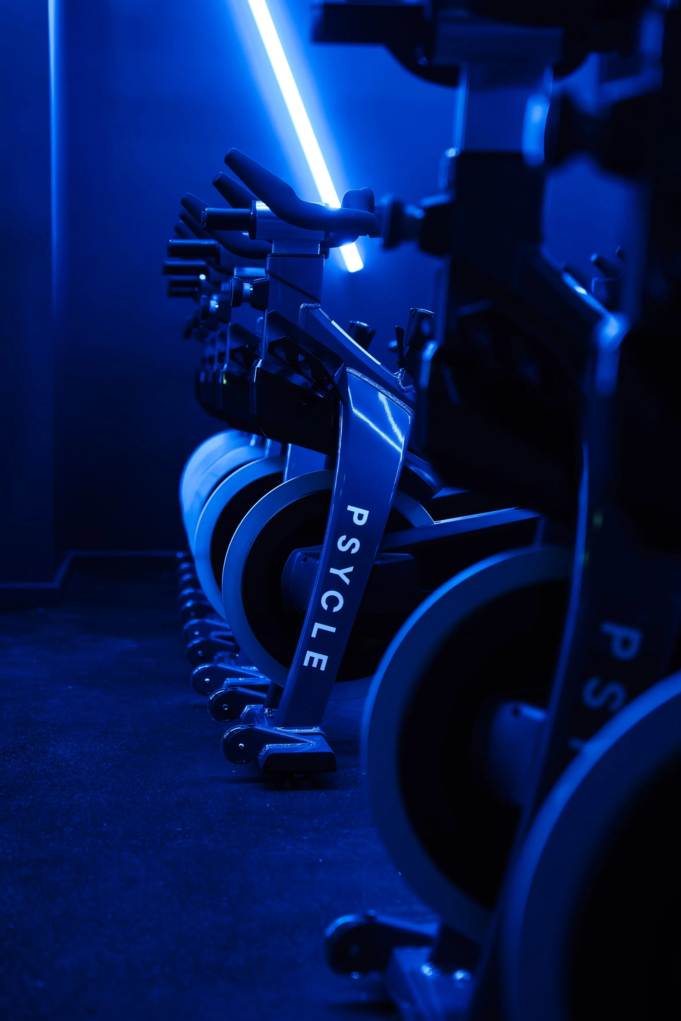 Spin bikes lined up in a Psycle London Bridge studio.