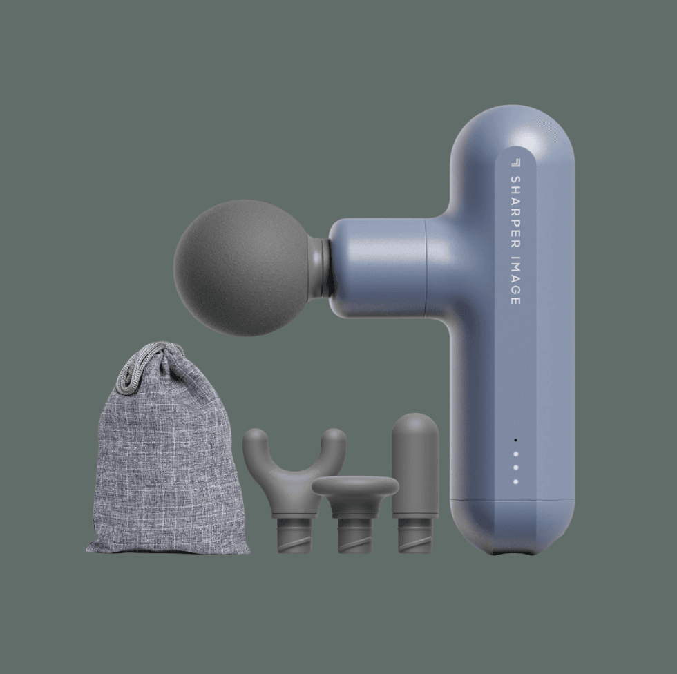 Blue massage gun with four attachments and a gray storage bag.