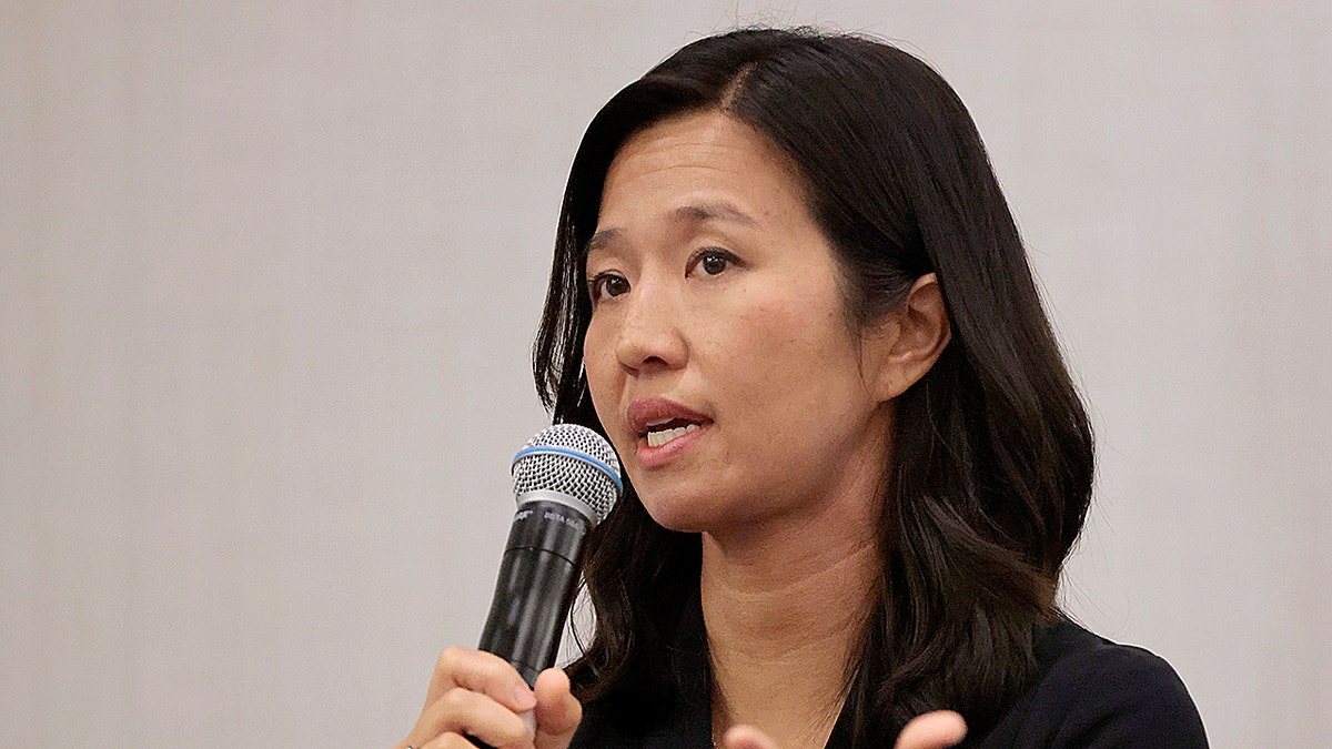 Boston Mayor Michelle Wu speaking at a podium