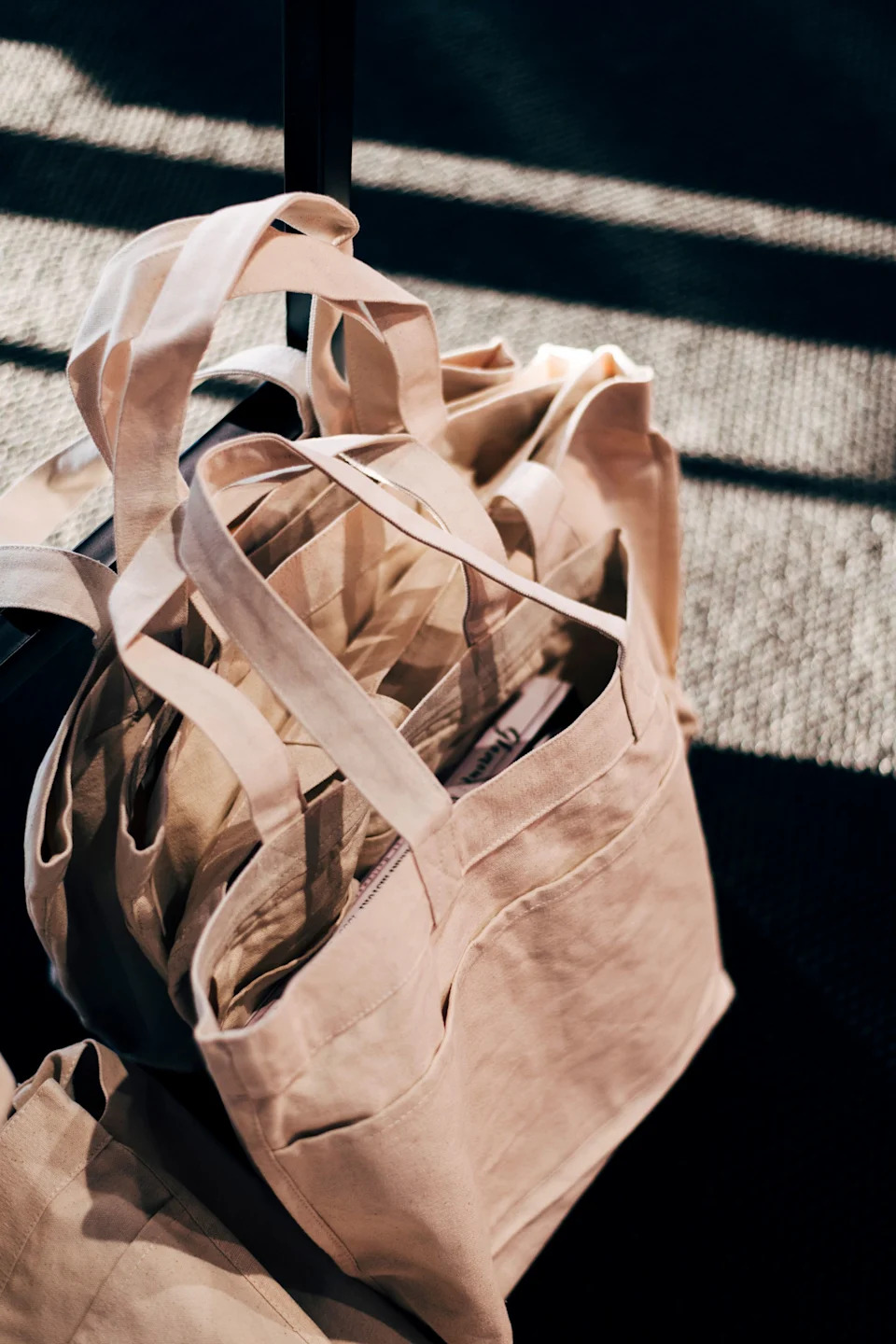 Muji tote bags were gifted with a copy of Glamour: An Extraordinary History.