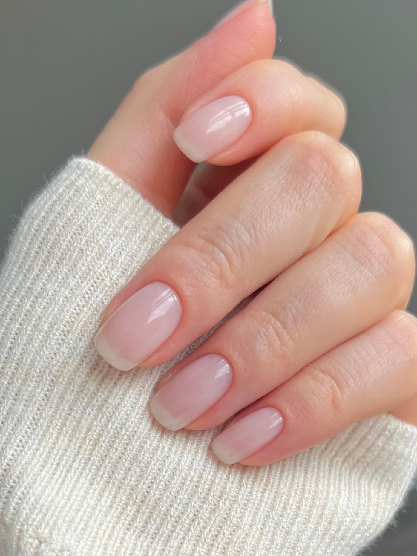 A square-shaped, sheer milky manicure