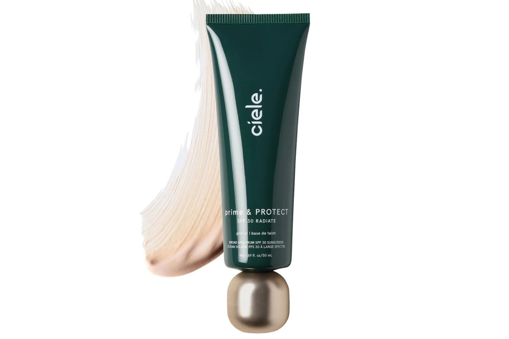 Ciele Prime & Protect SPF 30 Radiate primer in a dark green tube, with a swatch of the product.