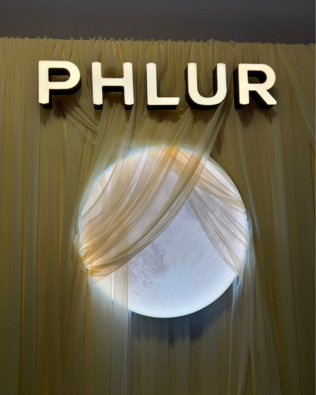 The Phlur backdrop at Sephoria.