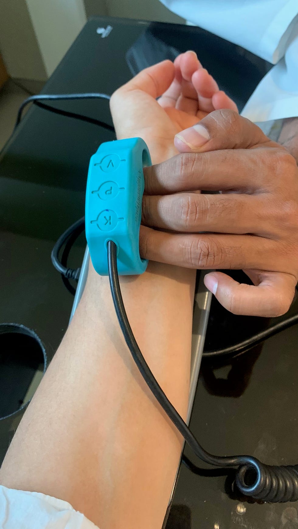 device measuring health metrics on a wrist at dharana