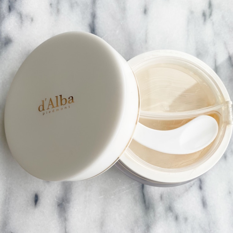 The D’Alba Piedmont White Truffle Double Serum & Cream open with the lid beside it.
