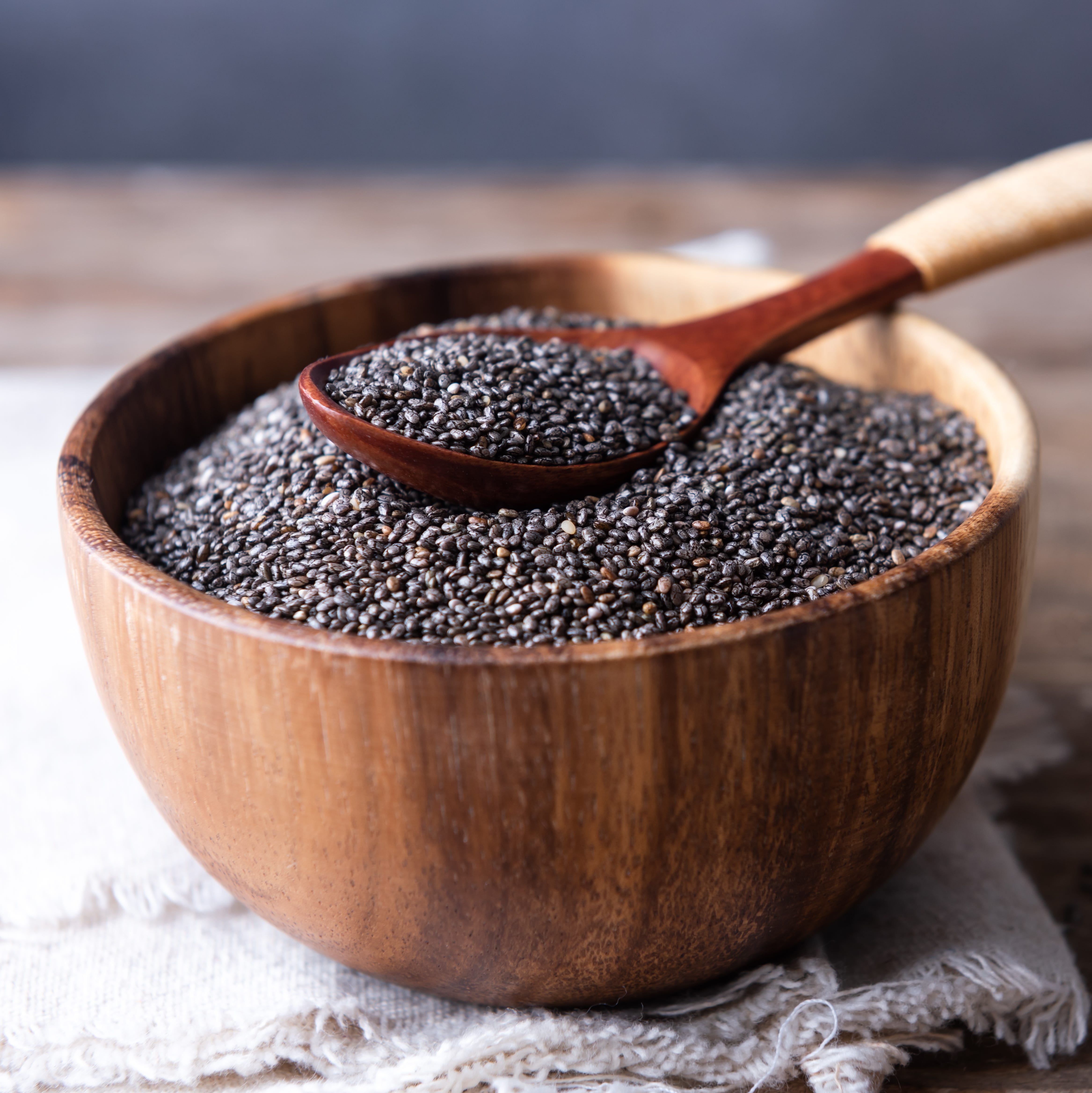 Bowl and spoon with chia seeds closeup