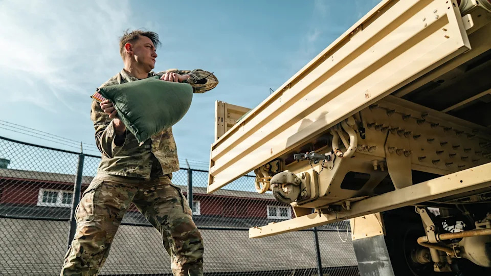 Sgt. Aaron Troutman/U.S. Army - PHOTO: U.S. Army Sgt. Christopher Smith assigned to 1st Battalion, 3d U.S. Infantry Regiment (The Old Guard) lifts a 40-lbs sandbag during the new Combat Field Test (CFT), at Joint Base Myer-Henderson Hall, Va.