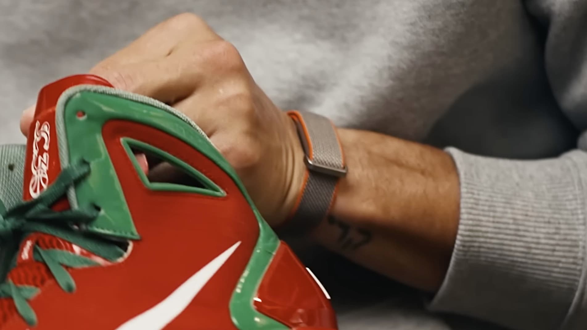 Basketball player Steph Curry wearing an unreleased screenless Fitbit wearable.