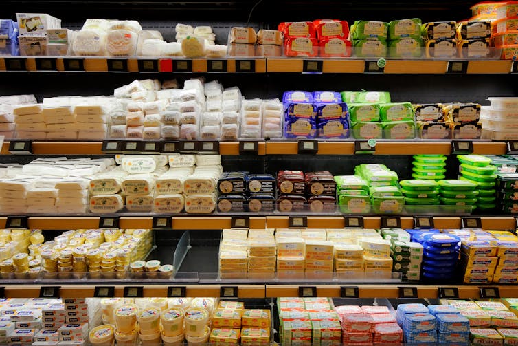 Supermarket shelves full of French butter.