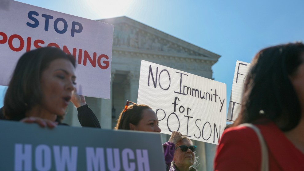 People protest outside the supreme court, holding signs that say "no immunity for poison."