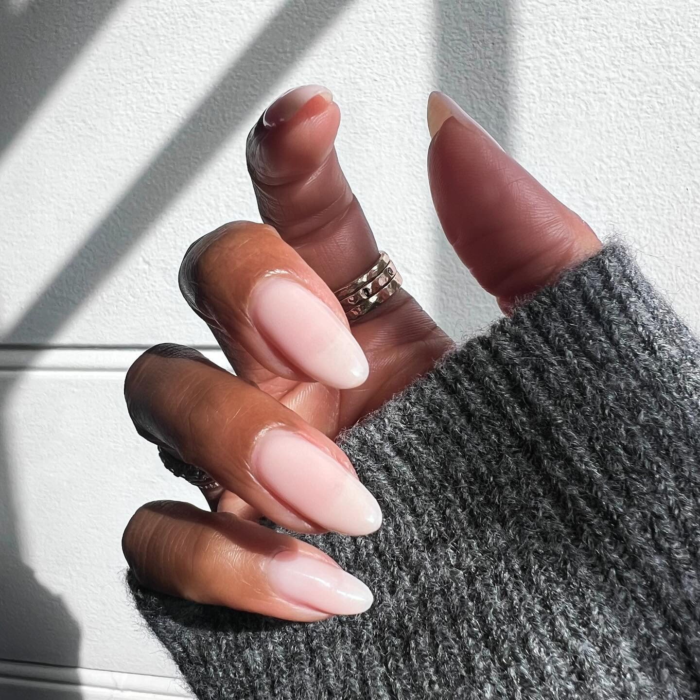 An almond-shaped sheer milky manicure