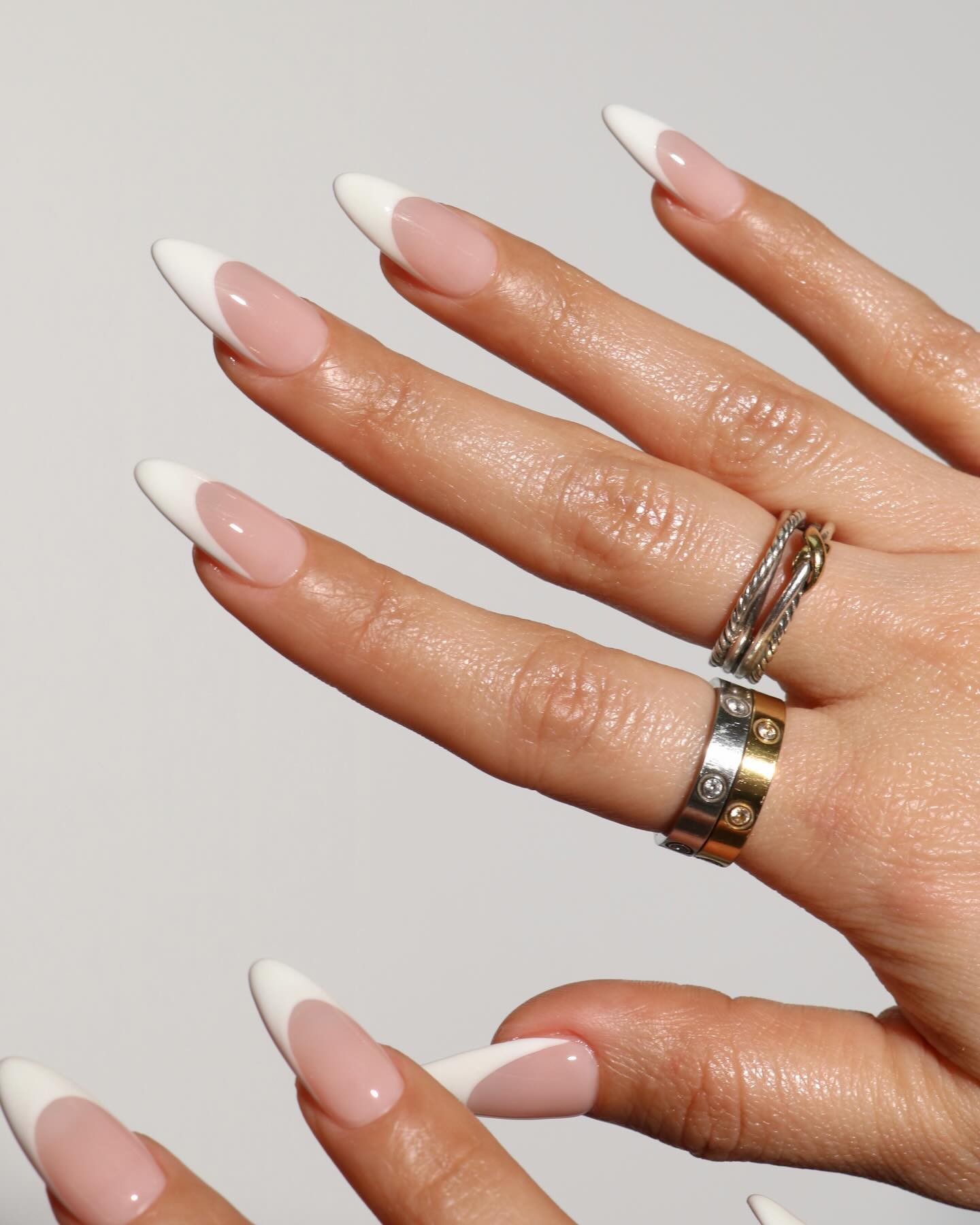 Acrylic French nails.