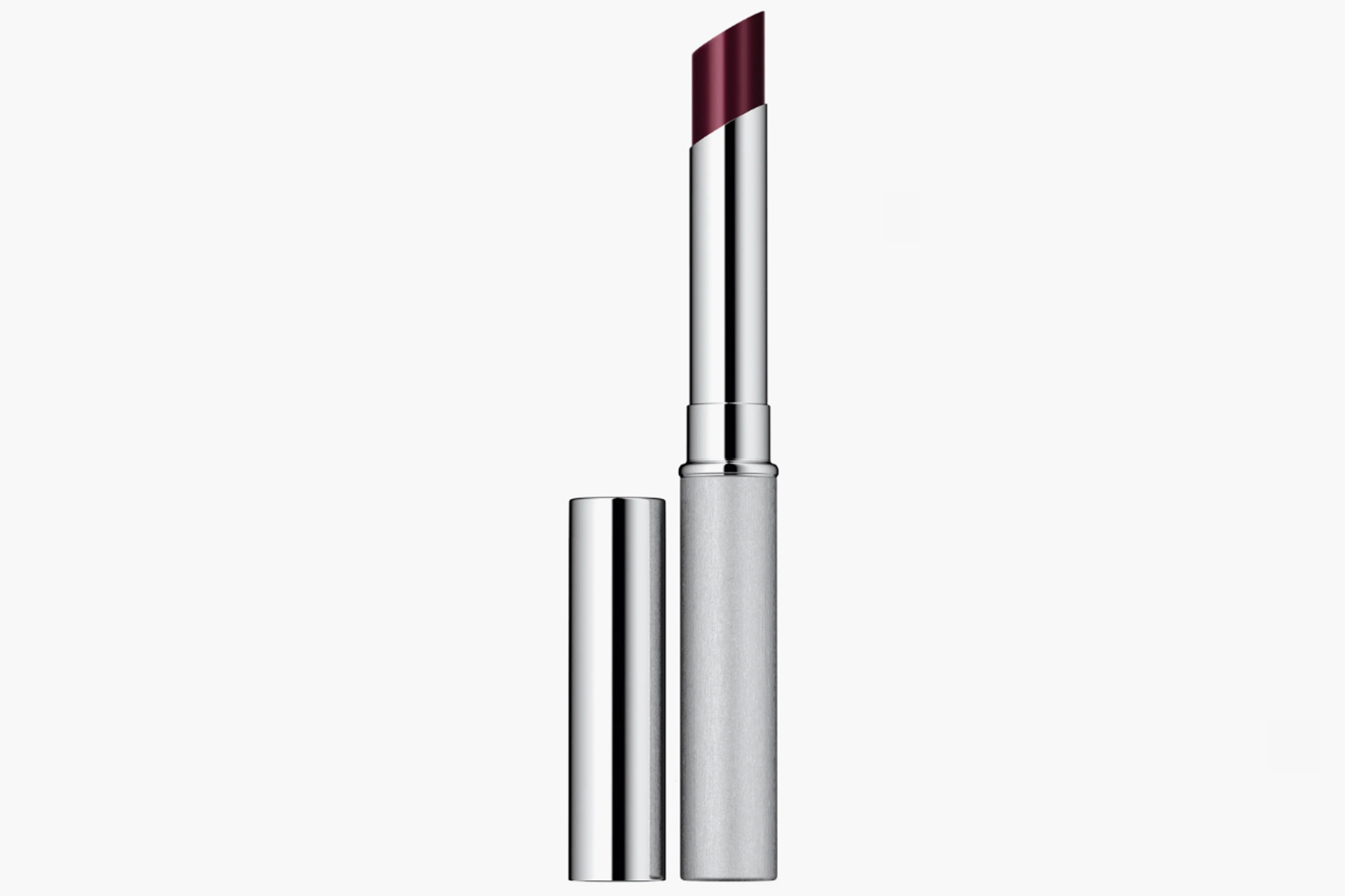 A burgundy lipstick in a silver tube, with the cap placed beside it.