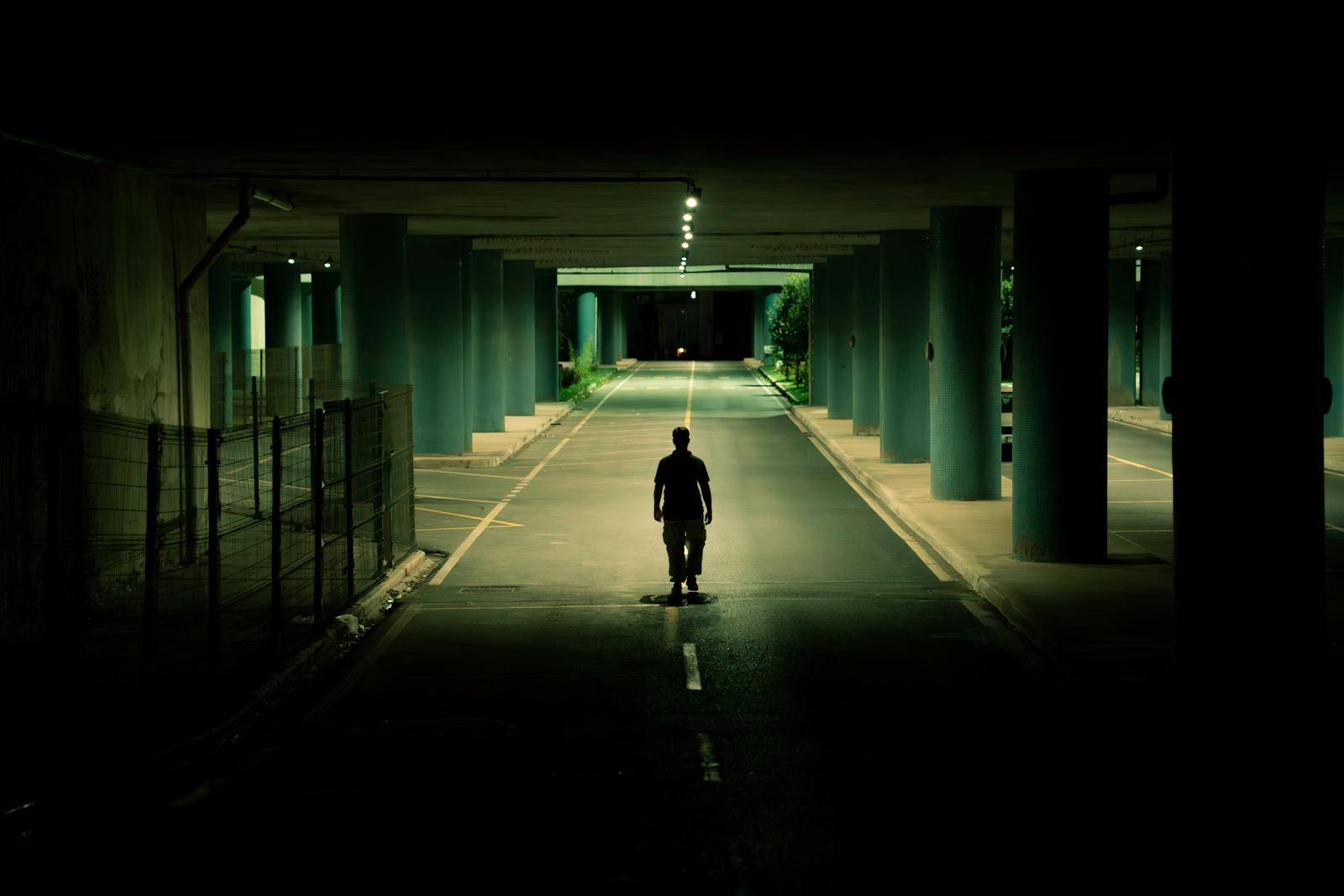 person walking empty street