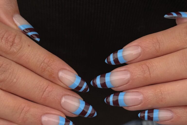 An image of blue and brown striped French tips.