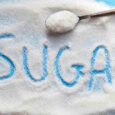 Artificial sweetener crystals with the word “sugar” written in them, illustrating research on sugar-free products and brain health
