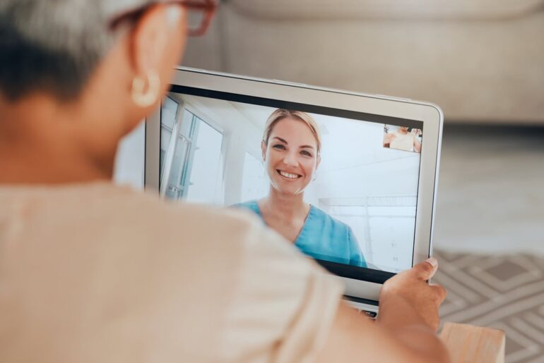 Two people participating in a telehealth session.