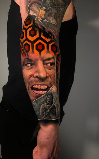Horror-themed sleeve on the arm featuring characters and themes from various films